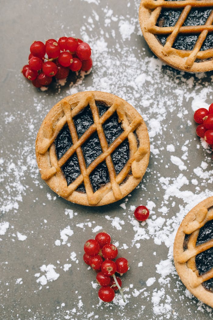 process-img A delectable berry tart with lingonberries, captured in an artistic overhead shot.